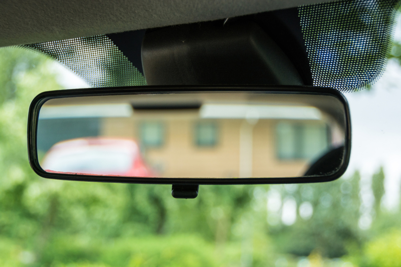 Tab on Rearview Mirror | Getty Images Photo by Kyaw_Thiha
